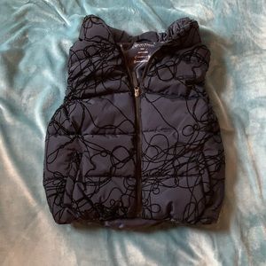 Navy blue puffer vest with black squiggles